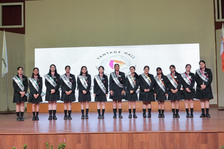 School Captain Alice Elangbam receiving her leadership badge during Investiture Ceremony 2026-27 at Vantage Hall - best boarding school in Dehradun