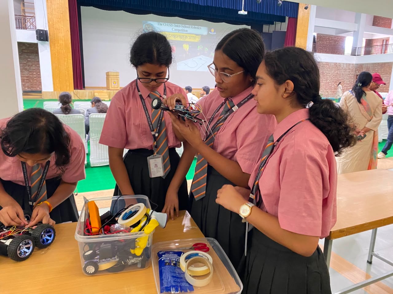 Robotics team demonstrating algorithmic calibration on their custom chassis at the best girls boarding school in Dehradun