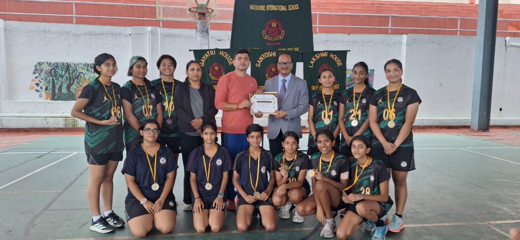 Vantage Hall Under-17 basketball team lifting the Silver runner-up trophy at the MSSA Tournament - best girls boarding school in Dehradun india