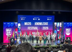 Vantage Hall delegates holding their MU20 Knowledge Festival awards on stage - best boarding school in Dehradun