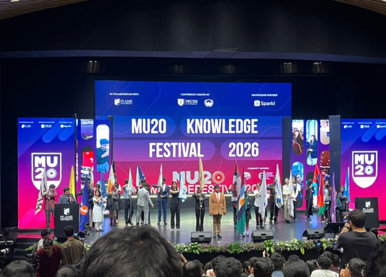 Vantage Hall delegates holding their MU20 Knowledge Festival awards on stage - best boarding school in Dehradun