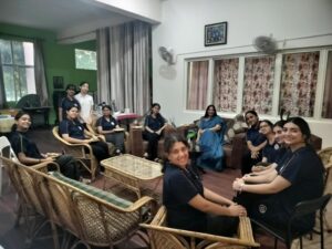 Class XII students engaging in mentorship tea sessions with Ma'am Parmar in the residential lounge at Vantage Hall - best girls boarding school in Dehradun