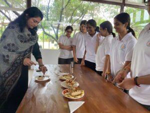 Students from Grades 9 to 12 preparing dishes during the Inter-Club Cooking Competition at Vantage Hall - best girls boarding school in Dehradun India