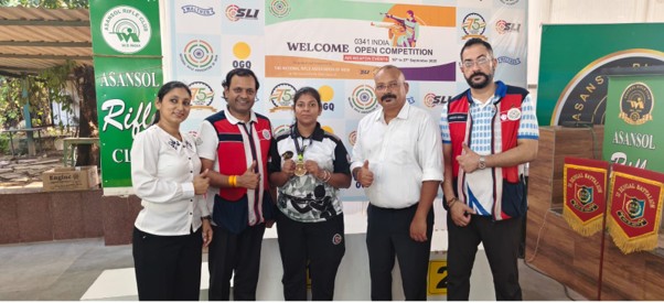 Alumna Priya Rani holding the first-place gold trophy at the India Open shooting competition - best girls boarding school in Dehradun India