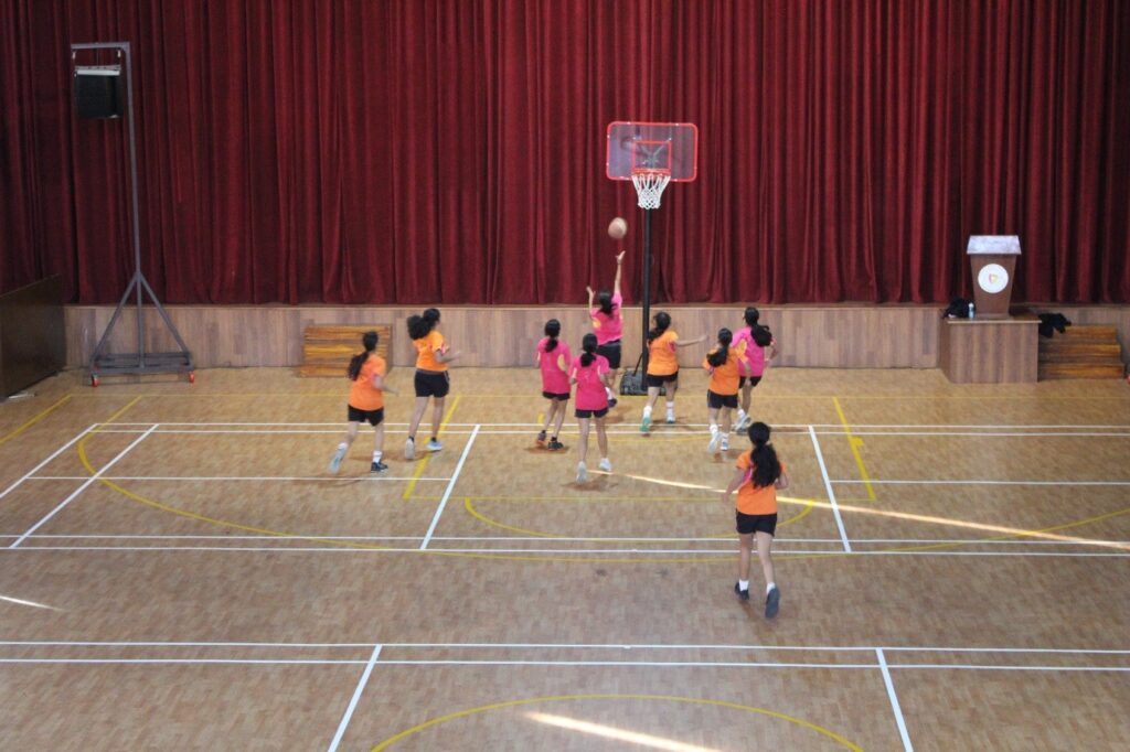 Student athletes competing during the Inter-House Basketball Tournament at Vantage Hall - best girls boarding school in Dehradun