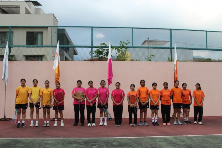 Student athletes serving and volleying during the Inter-House Tennis Competition at Vantage Hall - best girls boarding school in Dehradun India