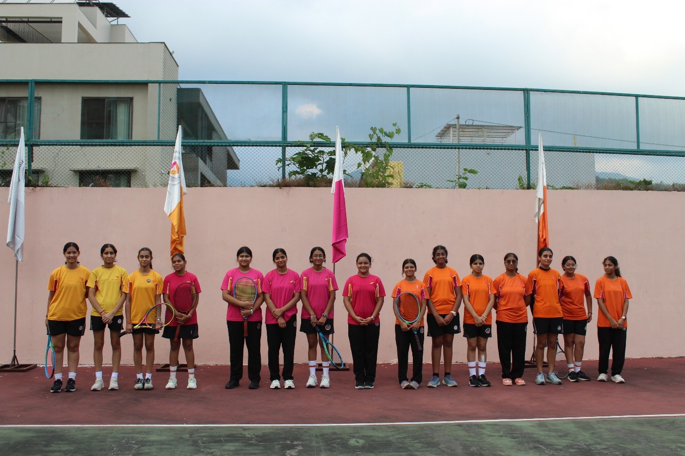 Student athletes serving and volleying during the Inter-House Tennis Competition at Vantage Hall - best girls boarding school in Dehradun India