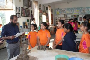 Students participating in canvas painting and pottery during the Inter-House Creative Arts Competition at Vantage Hall - best girls boarding school in Dehradun