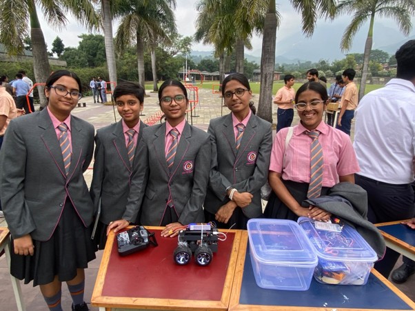 Vantage Hall robotics team holding the first-place trophy for the Fastest Line Follower challenge at Techverse - best girls boarding school in Dehradun